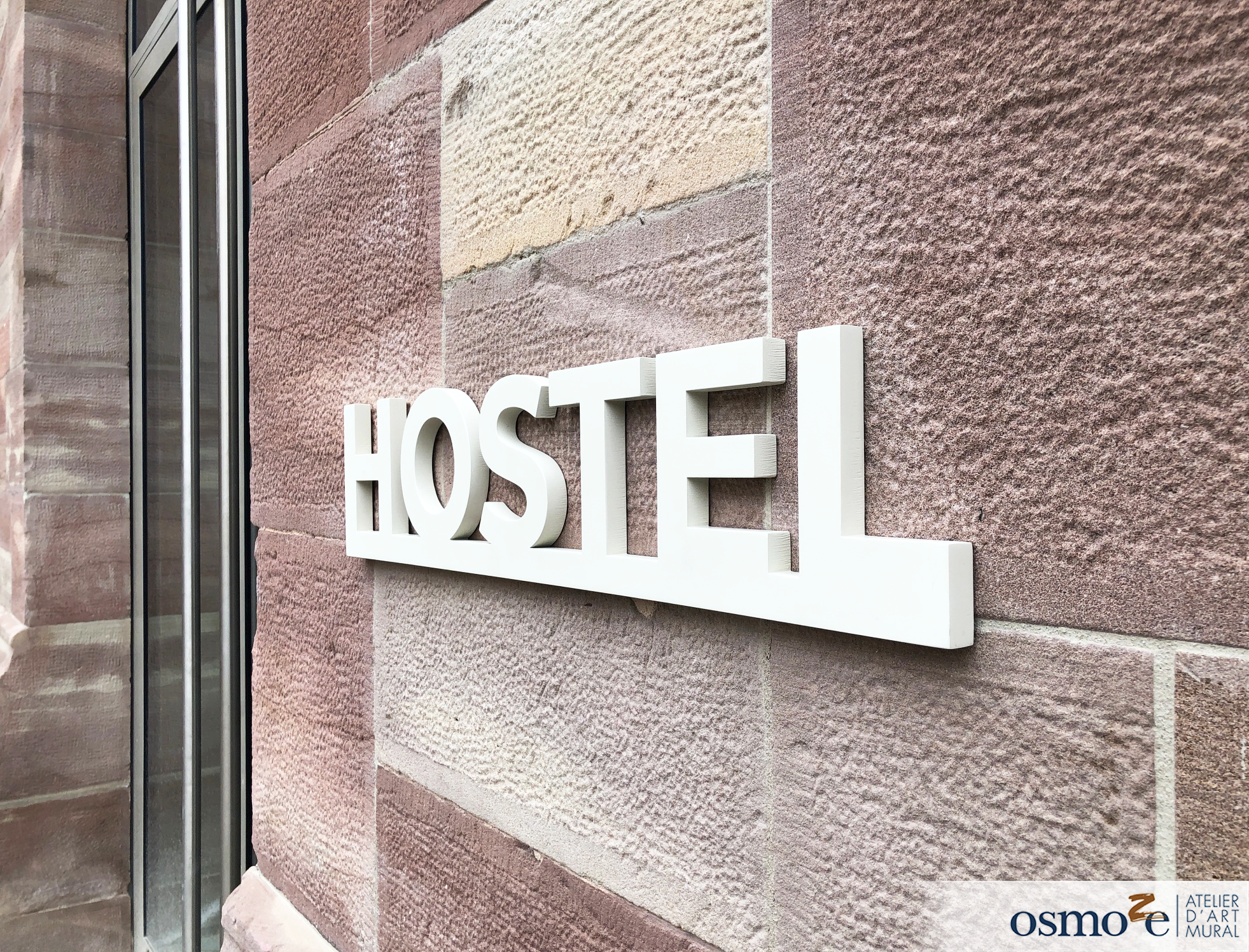 Enseigne en acier et toile imprimée, avec sa signalétique extérieure, Osmoze réaménage la Manufacture Des Tabacs – Strasbourg (67)